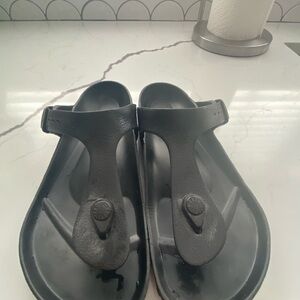 Birkenstock Gizeh EVA sandals in black.